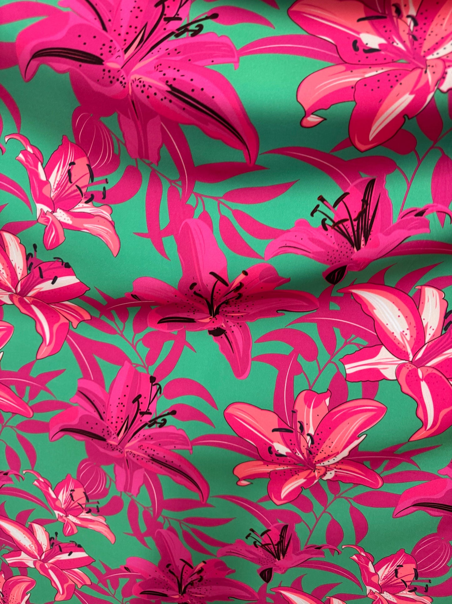 New flower design pink/green print on great quality of poly spandex 4-way stretch 58/60” Sold by the YD.