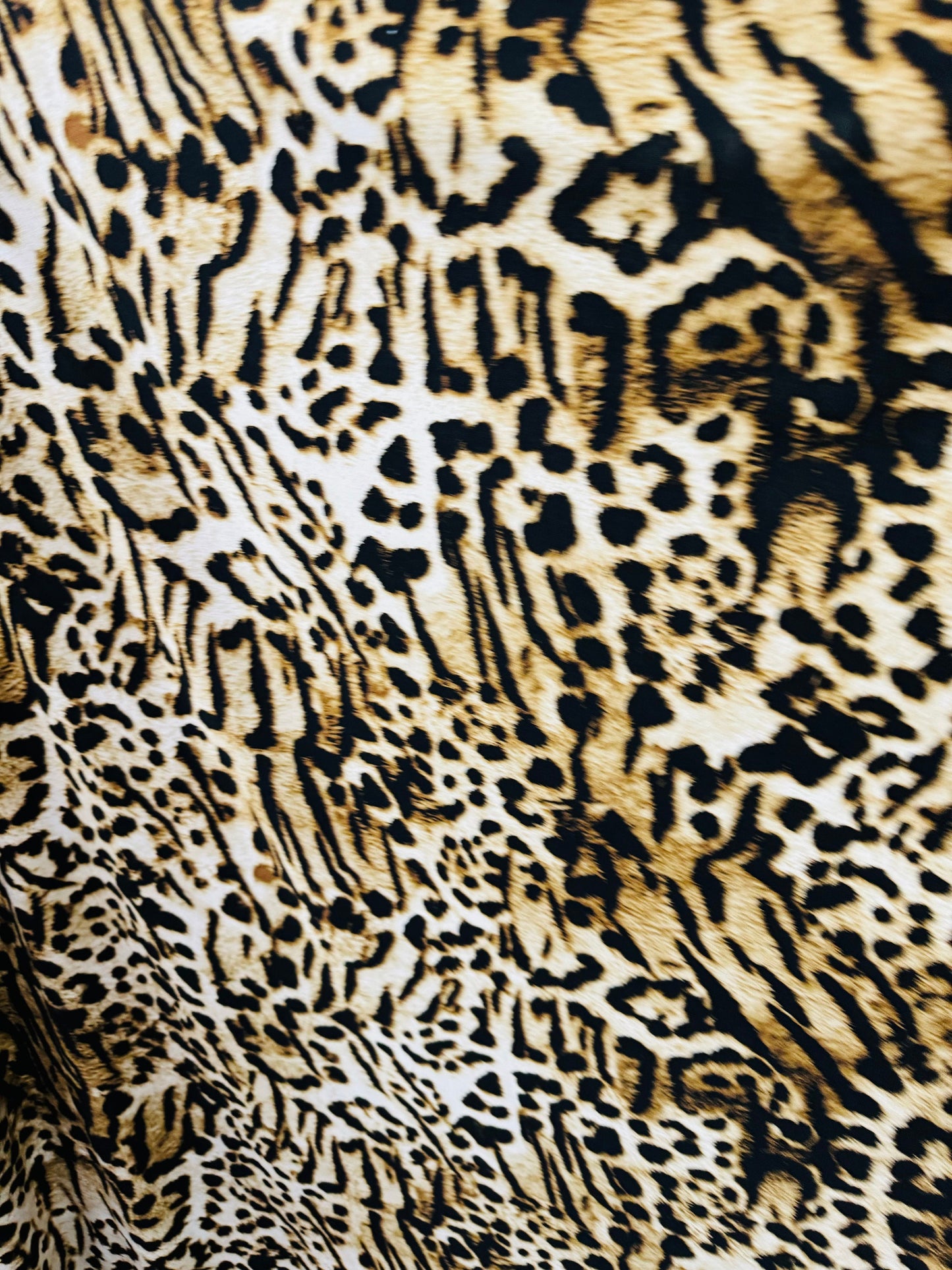 Wild Leopard design print on poly spandex medium weight 4-way stretch 58/60”