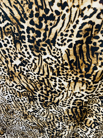 Wild Leopard design print on poly spandex medium weight 4-way stretch 58/60”