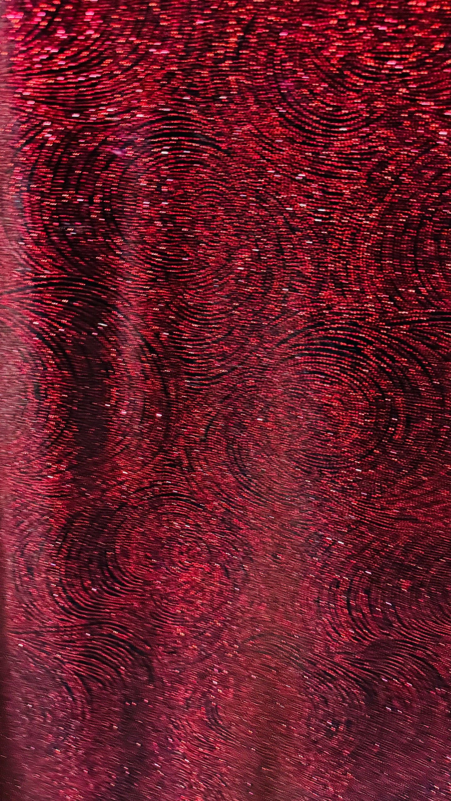 Swirl design on stretch velvet with glitter black/red 4-way stretch 58/60”