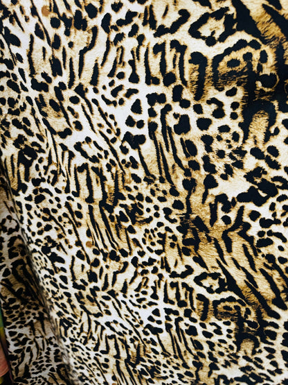 Wild Leopard design print on poly spandex medium weight 4-way stretch 58/60”