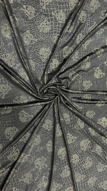 New skull design on embossed metallic poly spandex 2-way stretch 58/60” Sold by the YD. Ships worldwide from Los Angeles California USA