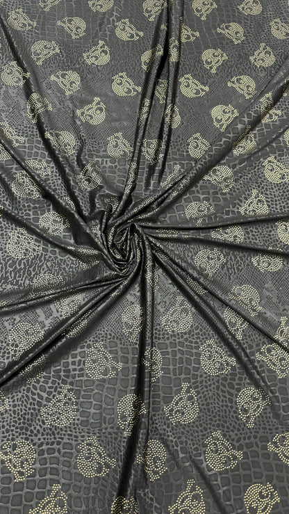 New skull design on embossed metallic poly spandex 2-way stretch 58/60” Sold by the YD. Ships worldwide from Los Angeles California USA