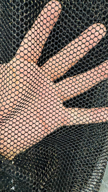 Metallic fishnet Black/gold 2-way stretch 58/60” Sold by the YD. Ships Worldwide from Los Angeles California USA.