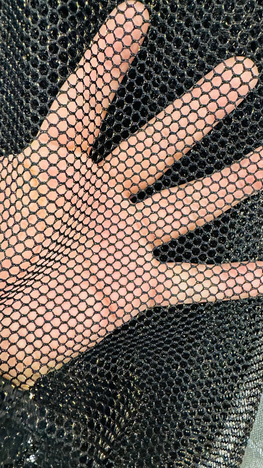 Metallic fishnet Black/gold 2-way stretch 58/60” Sold by the YD. Ships Worldwide from Los Angeles California USA.