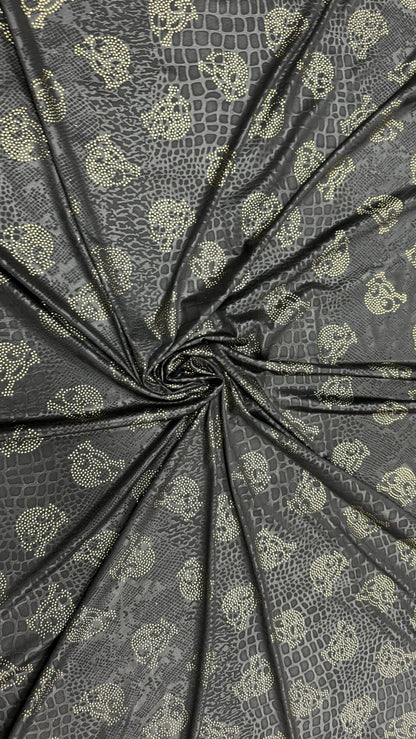 New skull design on embossed metallic poly spandex 2-way stretch 58/60” Sold by the YD. Ships worldwide from Los Angeles California USA