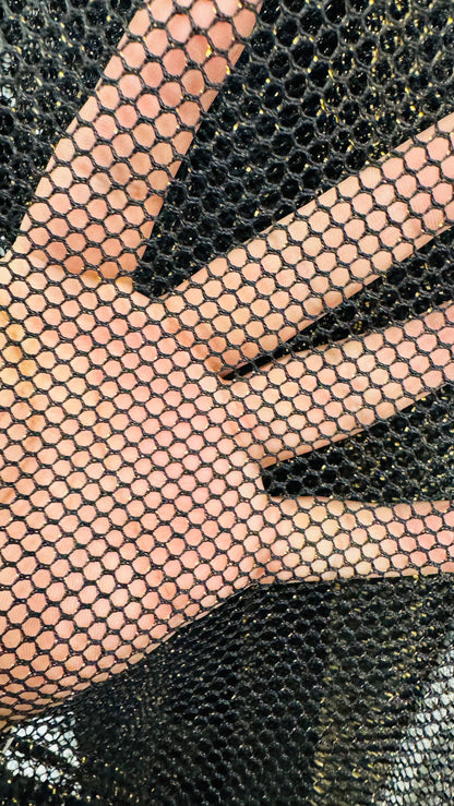 Metallic fishnet Black/gold 2-way stretch 58/60” Sold by the YD. Ships Worldwide from Los Angeles California USA.