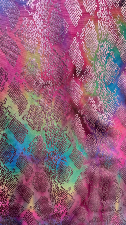 New exotic snake design print on tie dye metallic rainbow mesh 4-way stretch 58/60” Sold by the YD. Ships worldwide from Los Ángeles Ca