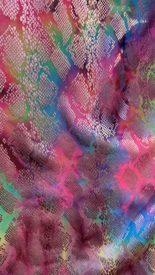 New exotic snake design print on tie dye metallic rainbow mesh 4-way stretch 58/60” Sold by the YD. Ships worldwide from Los Ángeles Ca