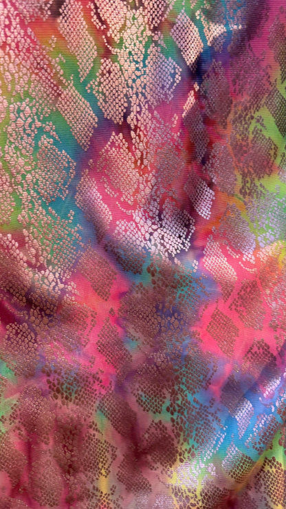 New exotic snake design print on tie dye metallic rainbow mesh 4-way stretch 58/60” Sold by the YD. Ships worldwide from Los Ángeles Ca