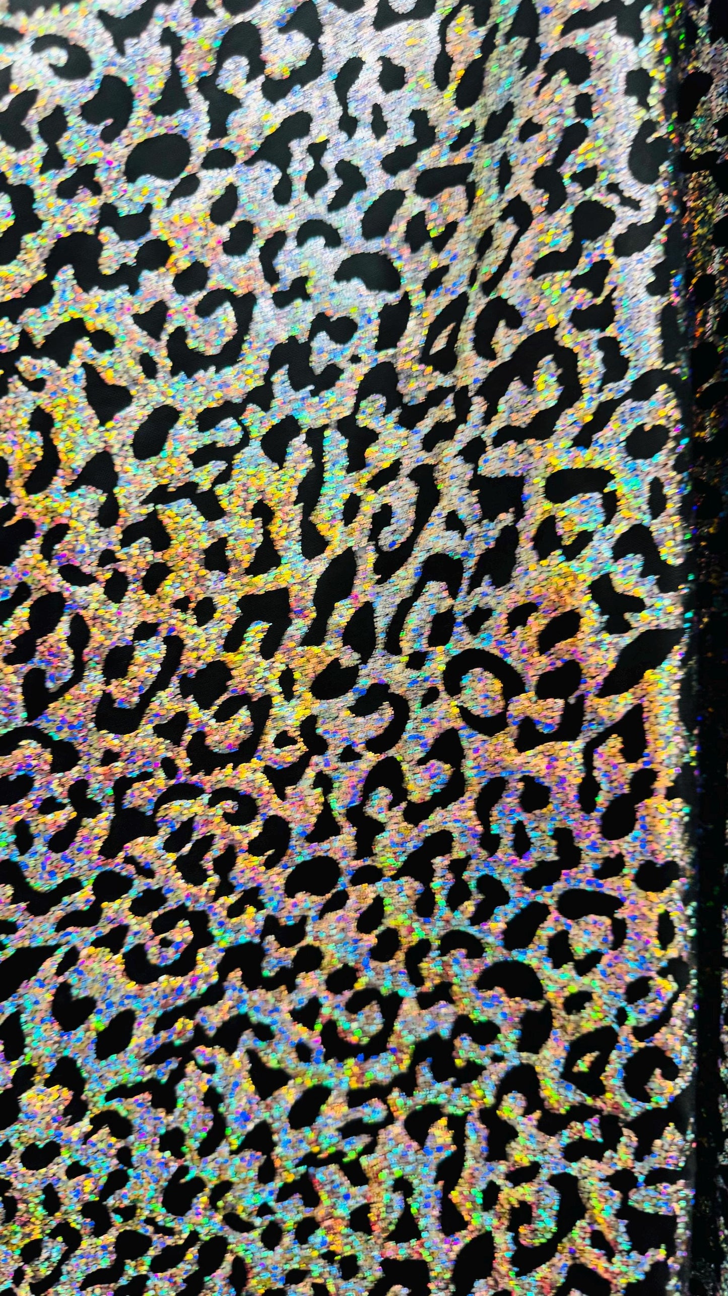 Hologram exotic leopard design metallic poly  spandex 2-way stretch 58/60” Sold by the YD. Ships worldwide from Los Angeles California USA.