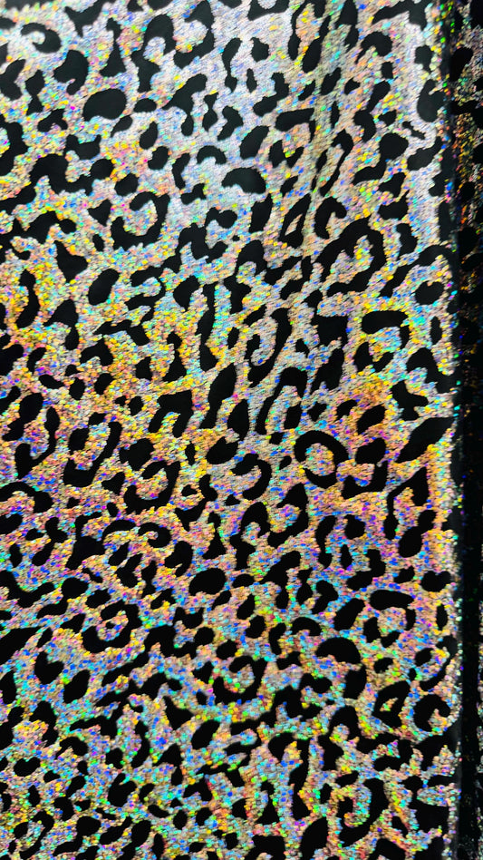 Hologram exotic leopard design metallic poly  spandex 2-way stretch 58/60” Sold by the YD. Ships worldwide from Los Angeles California USA.