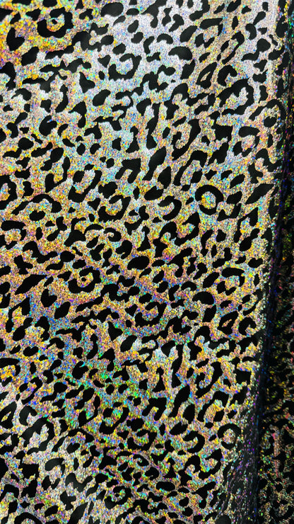 Hologram exotic leopard design metallic poly  spandex 2-way stretch 58/60” Sold by the YD. Ships worldwide from Los Angeles California USA.