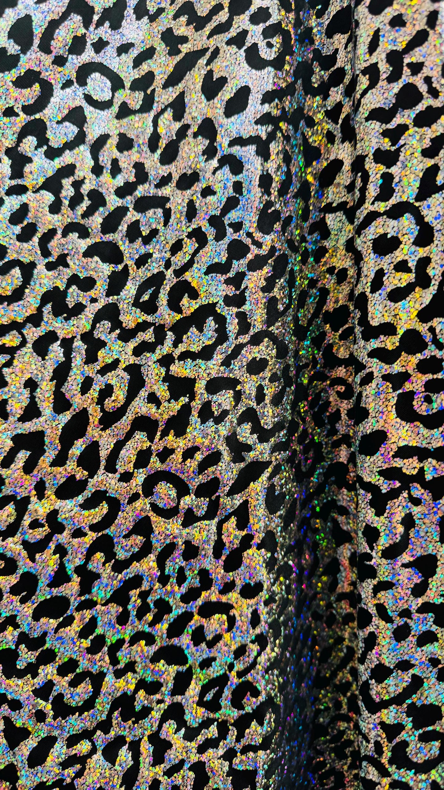 Hologram exotic leopard design metallic poly  spandex 2-way stretch 58/60” Sold by the YD. Ships worldwide from Los Angeles California USA.