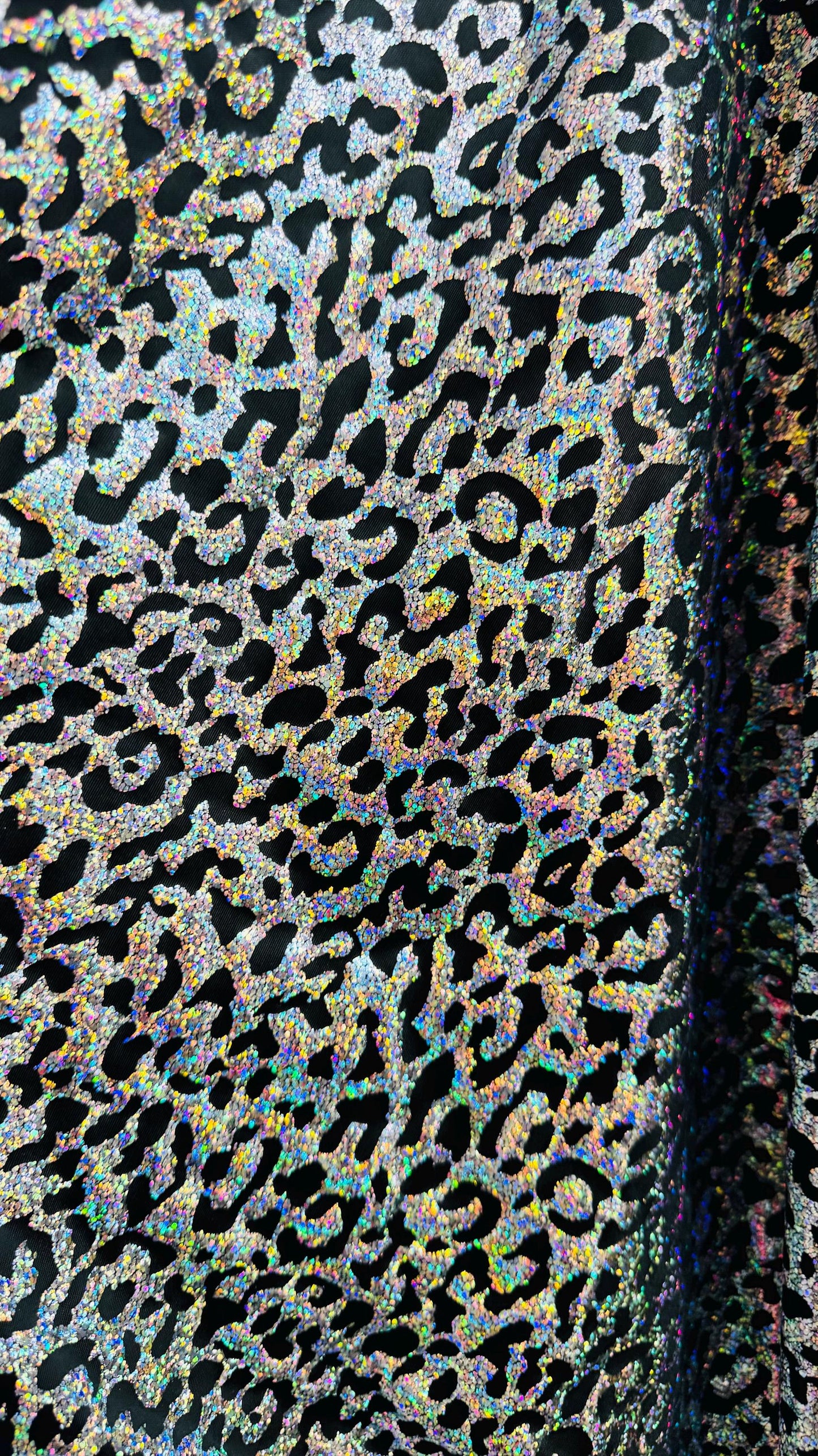 Hologram exotic leopard design metallic poly  spandex 2-way stretch 58/60” Sold by the YD. Ships worldwide from Los Angeles California USA.