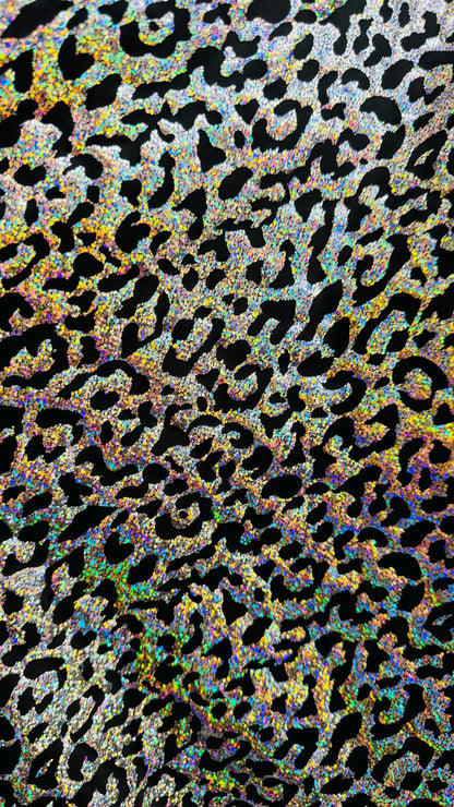 Hologram exotic leopard design metallic poly  spandex 2-way stretch 58/60” Sold by the YD. Ships worldwide from Los Angeles California USA.