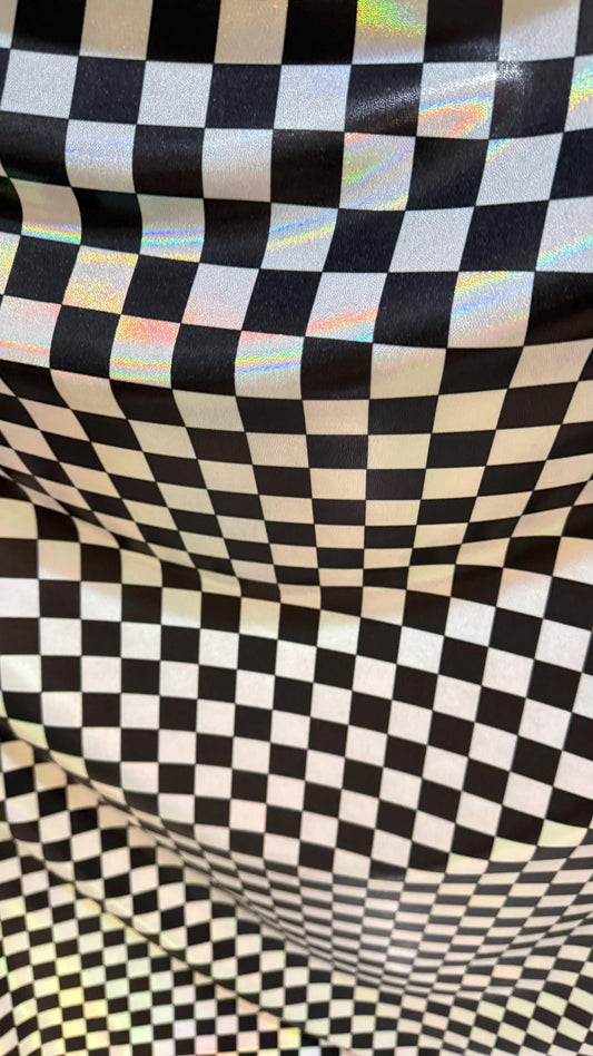 New Checkers Design iridescent W/Silver/Balck metallic nylon spandex 4-way stretch 58/60” Sold by the YD. Ships worldwide from Los Angeles