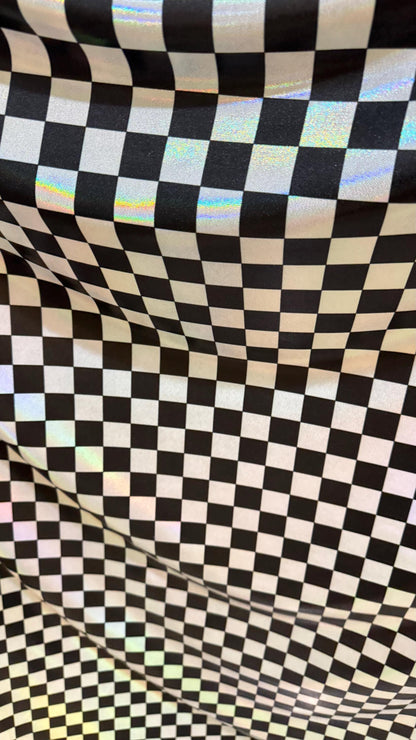 New Checkers Design iridescent W/Silver/Balck metallic nylon spandex 4-way stretch 58/60” Sold by the YD. Ships worldwide from Los Angeles