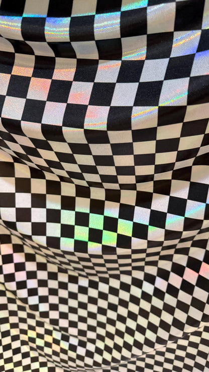 New Checkers Design iridescent W/Silver/Balck metallic nylon spandex 4-way stretch 58/60” Sold by the YD. Ships worldwide from Los Angeles