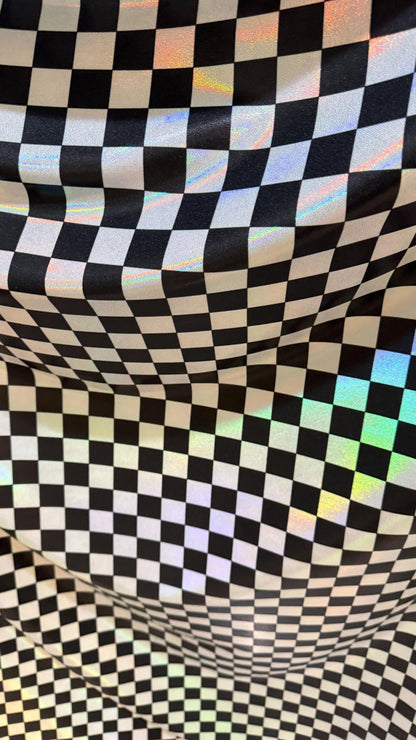 New Checkers Design iridescent W/Silver/Balck metallic nylon spandex 4-way stretch 58/60” Sold by the YD. Ships worldwide from Los Angeles