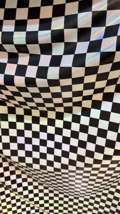 New Checkers Design iridescent W/Silver/Balck metallic nylon spandex 4-way stretch 58/60” Sold by the YD. Ships worldwide from Los Angeles