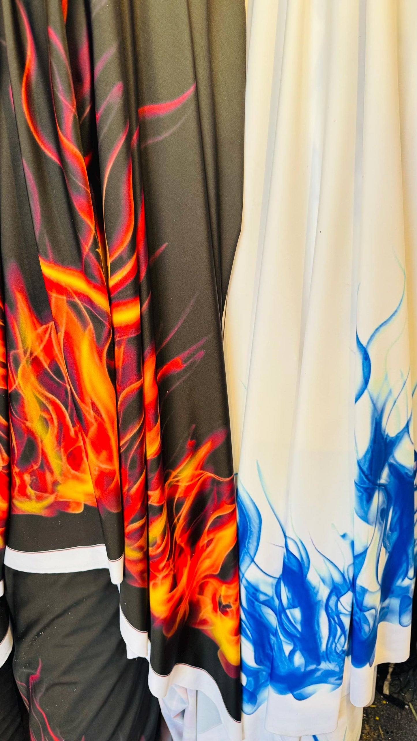 Flames design Black/Fire and White/Sapphire print on great quality of nylon spandex 4-way stretch 58/60” Sold by the YD. Ships Worldwide