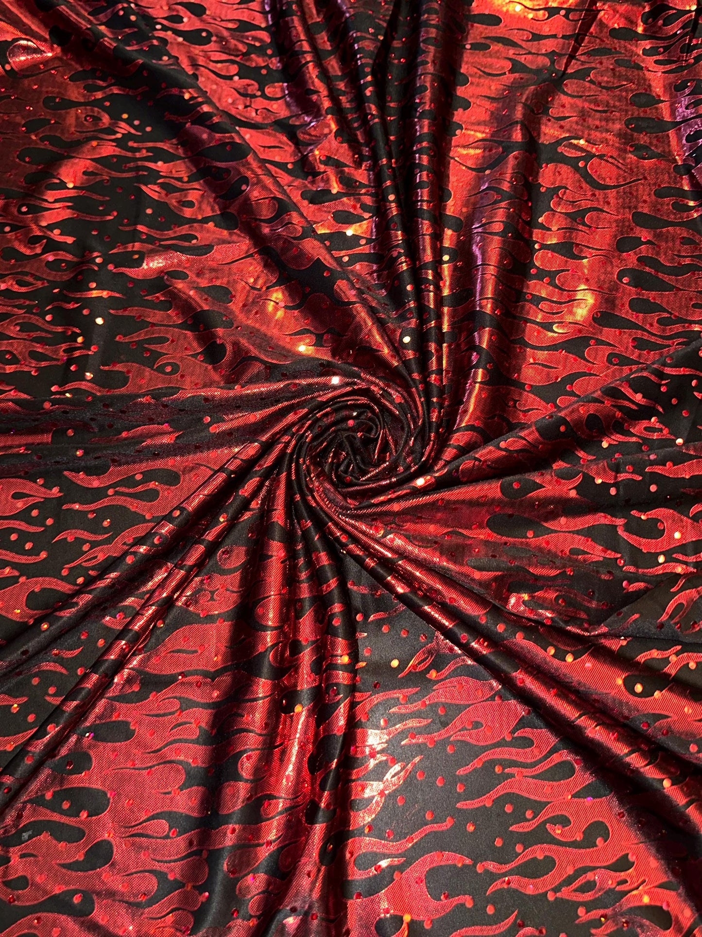Flames design Hologram Red/Black poly spandex 4 way stretch 58/60" Sold by the YD. Ships worldwide from Los Angeles California USA