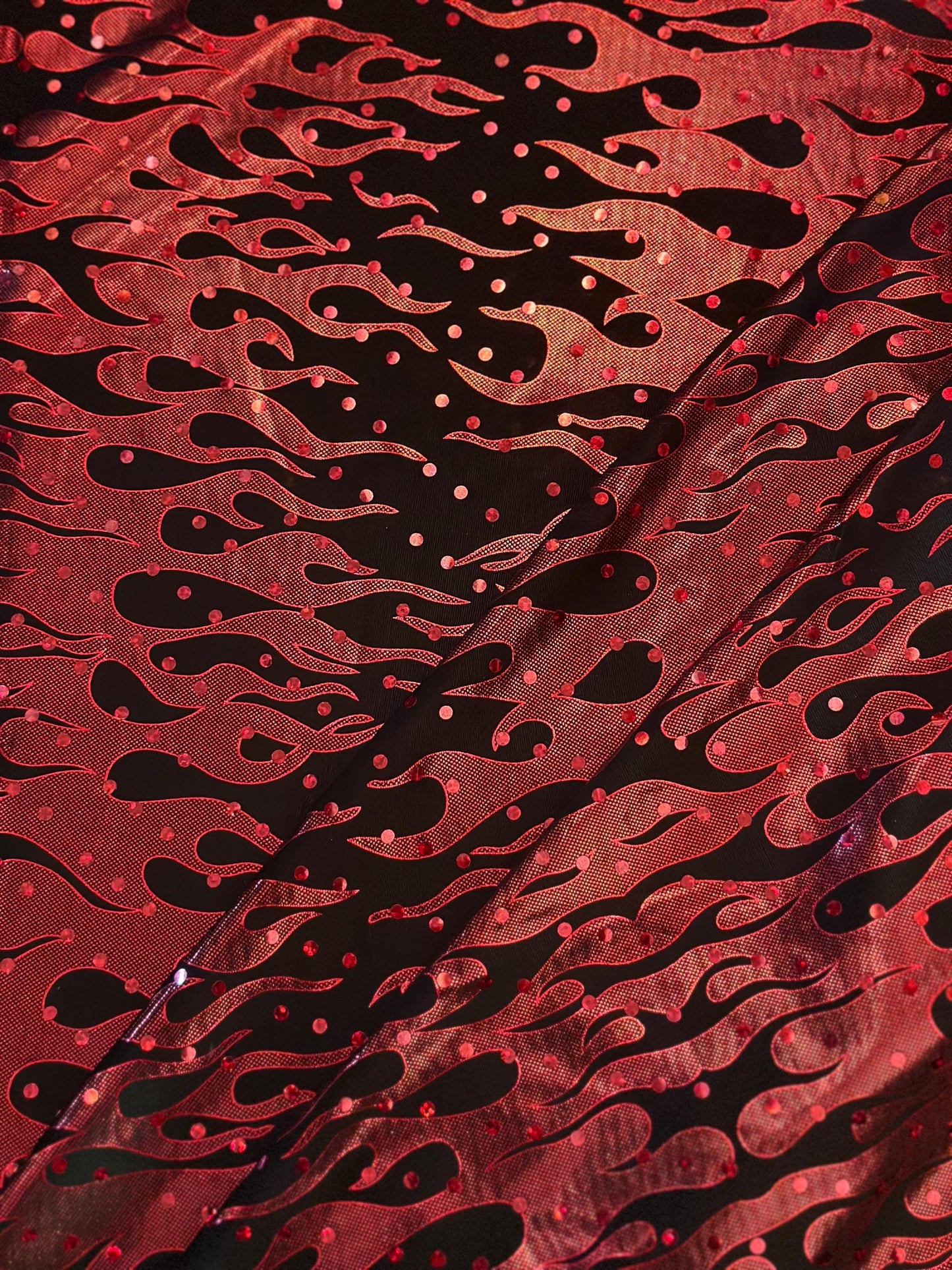 Flames design Hologram Red/Black poly spandex 4 way stretch 58/60" Sold by the YD. Ships worldwide from Los Angeles California USA