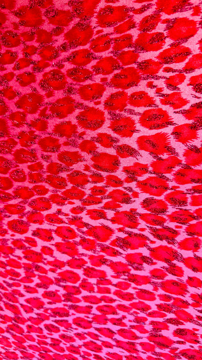 Leopard design Red/Pink  with glitter print on velvet 420gsm 4way stretch 58/60” Sold by the YD. Ships worldwide from Los Angeles California