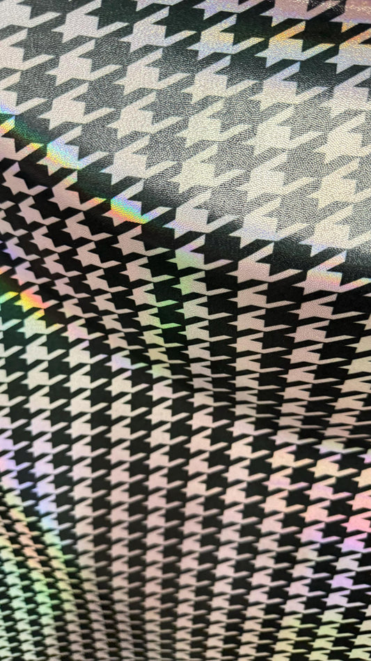 Houndstooth design nylon spandex with iridescent  foil 4way stretch 58/60" Sold by the yd. Ships worldwide from Los Angeles California USA.