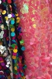 Iridescent Coral Paillette circle Sequins 58/60" with stretch mesh base.