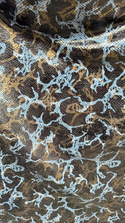 New Abstract design with skin snake foil  on stretch velvet 2-way 58/60”  Sold by the YD. Ships worldwide from Los Angeles California USA.