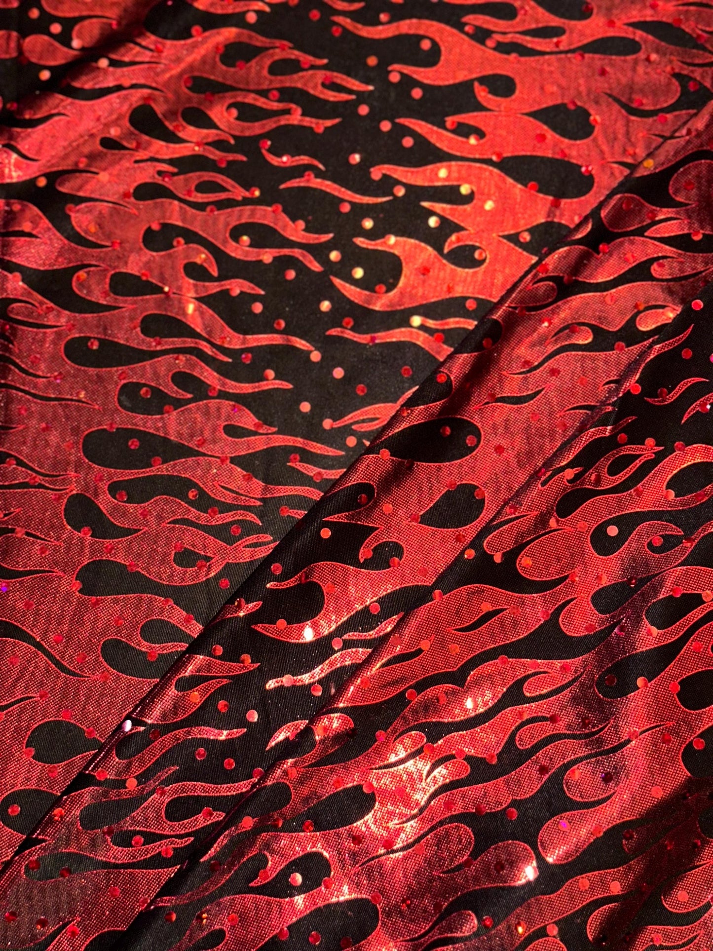 Flames design Hologram Red/Black poly spandex 4 way stretch 58/60" Sold by the YD. Ships worldwide from Los Angeles California USA
