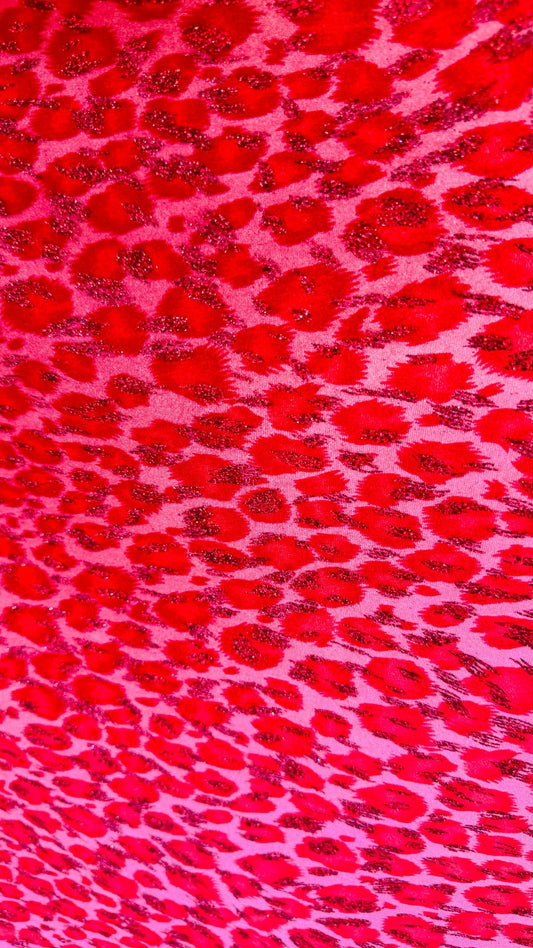 Leopard design Red/Pink  with glitter print on velvet 420gsm 4way stretch 58/60” Sold by the YD. Ships worldwide from Los Angeles California