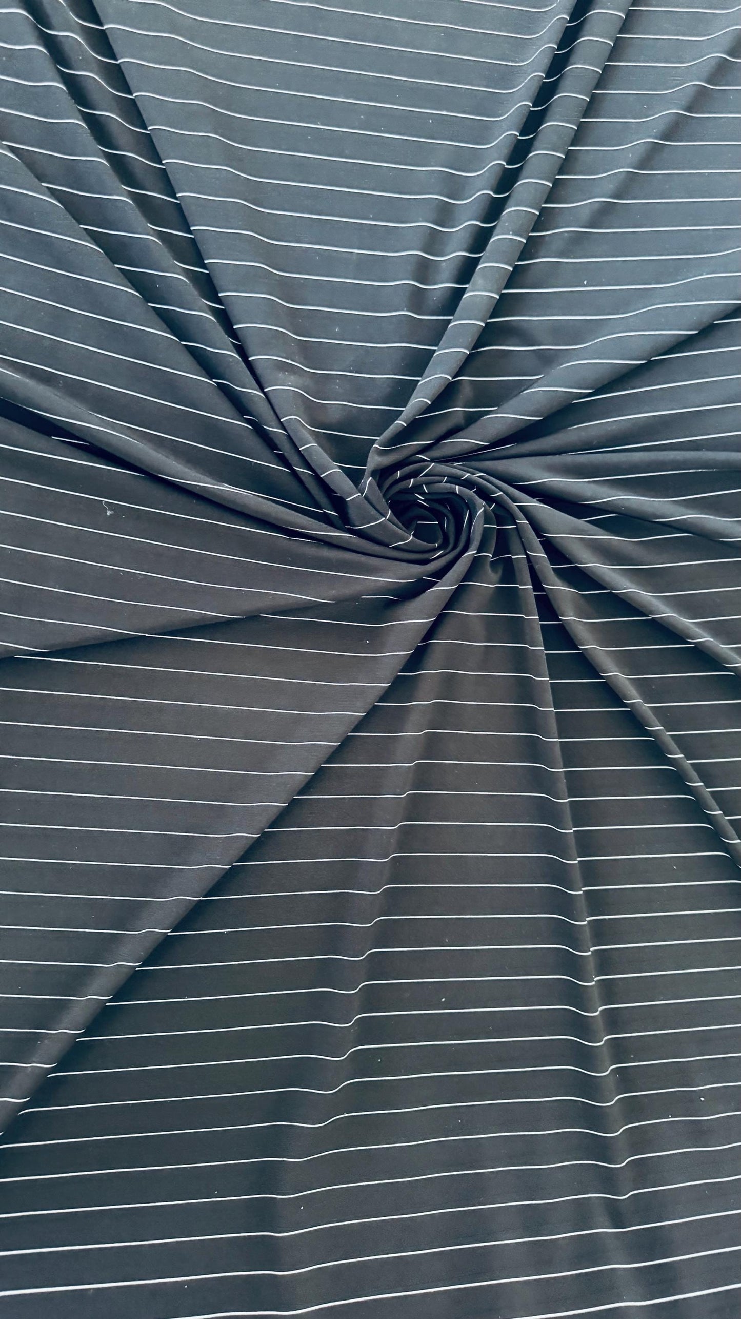 Pin stripes on Poly spandex 4-way stretch 58/60” Sold by the YD. Ships worldwide from Los Angeles California USA. High quality fabrics