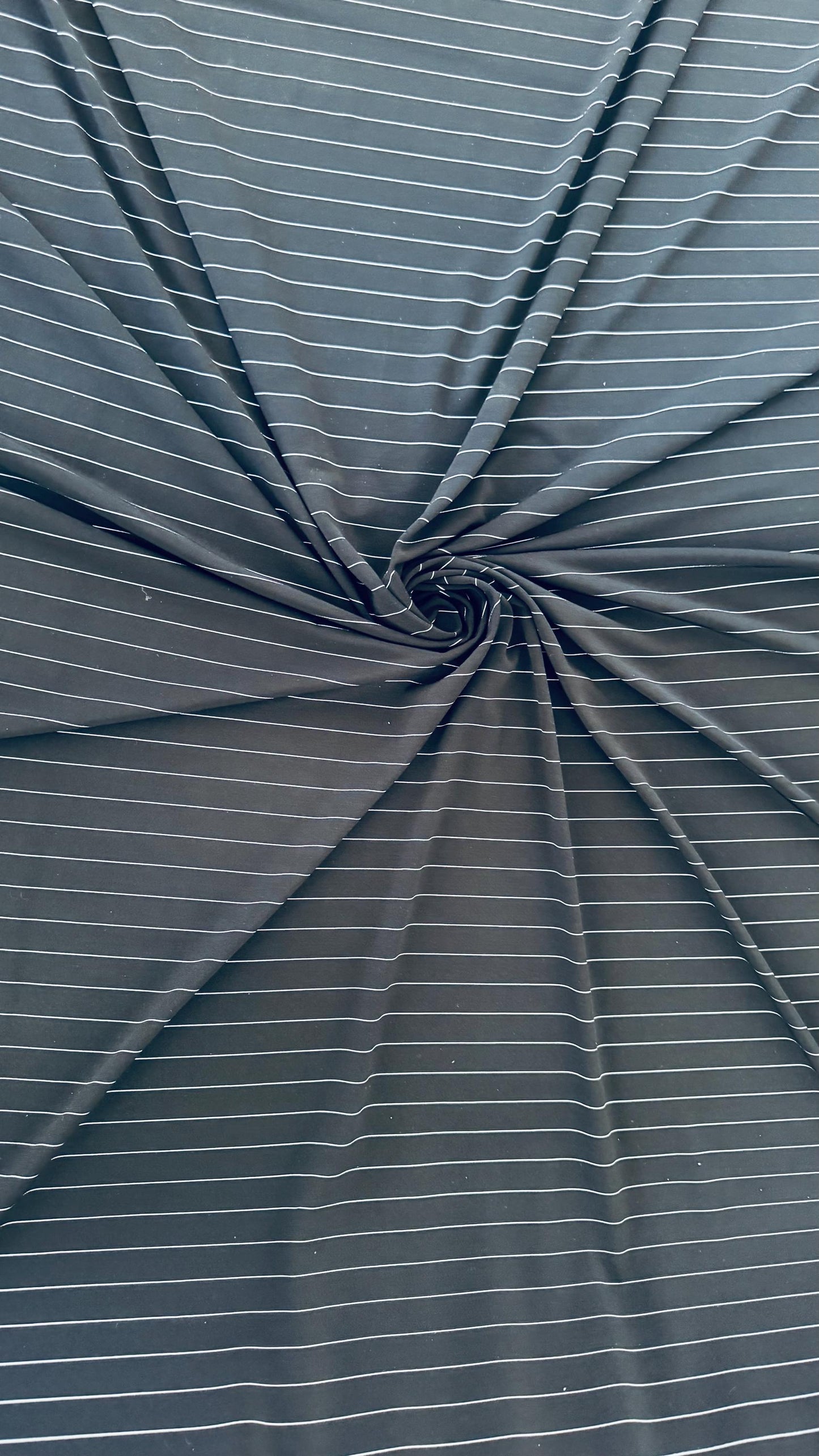 Pin stripes on Poly spandex 4-way stretch 58/60” Sold by the YD. Ships worldwide from Los Angeles California USA. High quality fabrics