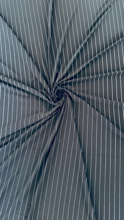 Pin stripes on Poly spandex 4-way stretch 58/60” Sold by the YD. Ships worldwide from Los Angeles California USA. High quality fabrics