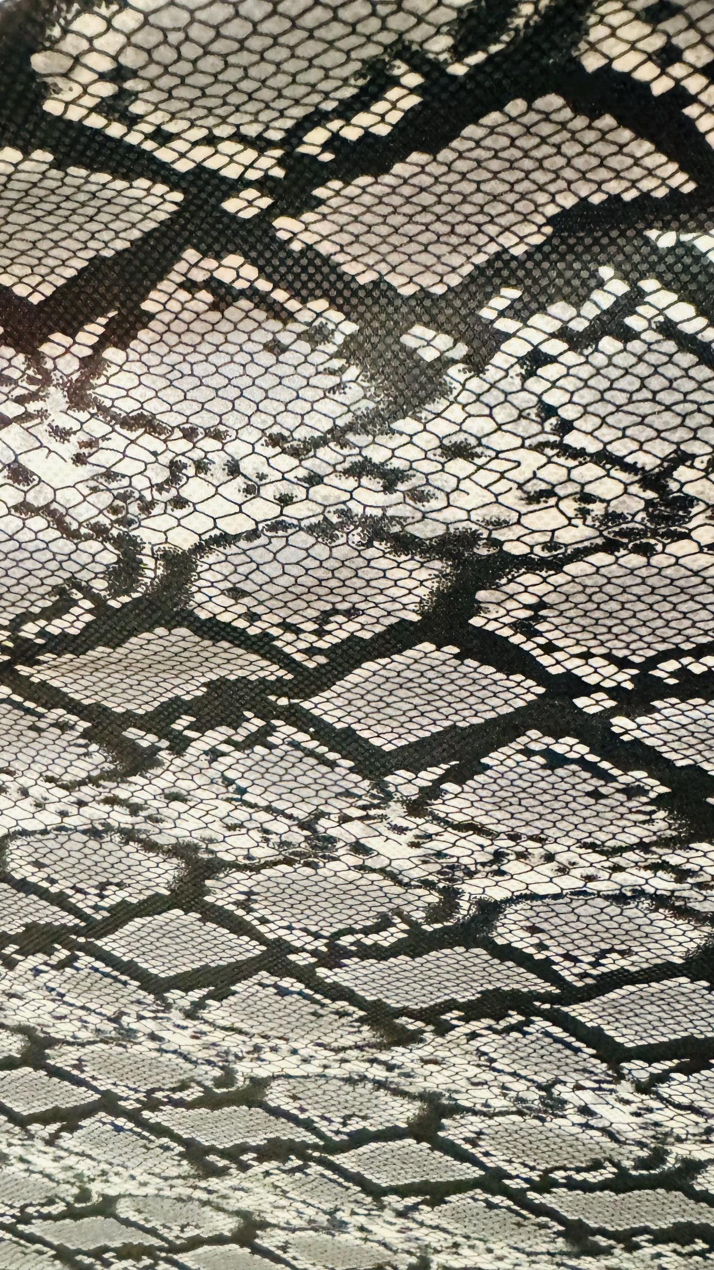 Exotic Snake design with clear foil on poly Interlock 2way stretch 58/60” Sold by the YD. Ships worldwide from Los Angeles California USA.