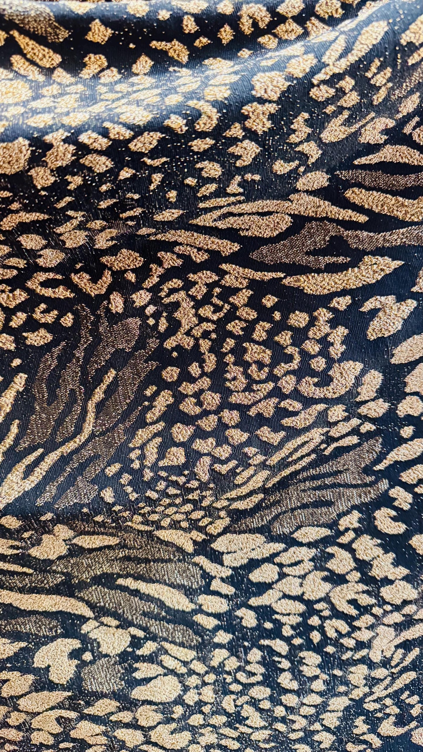 New Exotic Animal design Metallic slinky spandex 4way stretch 58/60" Sold by the YD. Ships worldwide from Los Angeles California USA.