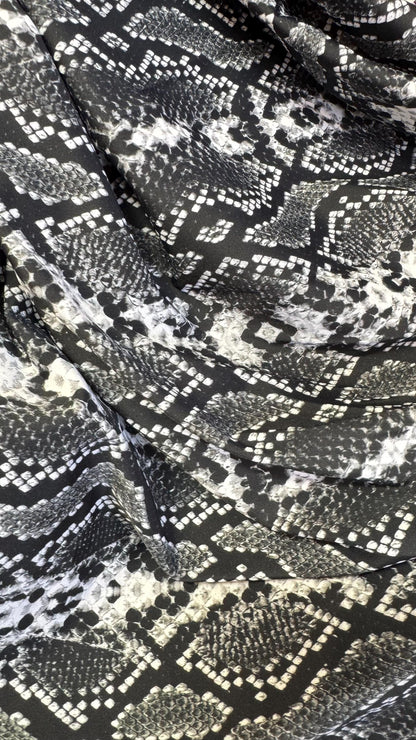 New snake print white/black  print on nylon spandex 4way stretch 58/60" Sold by the YD. Ships worldwide from Los Angeles California USA.