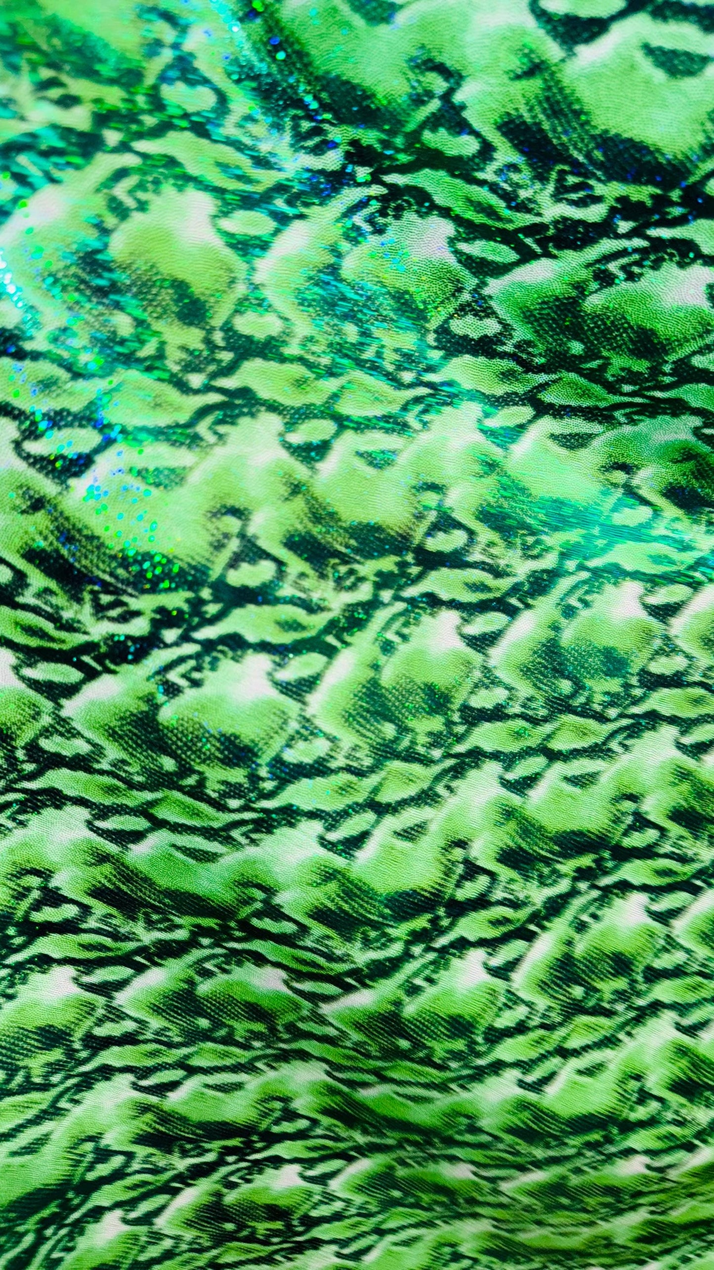 NEW Cobra snake design with hologram ilusión foggy foil all over print on nylon spandex 4way stretch 58/60" Sold by the YD. Ships worldwide