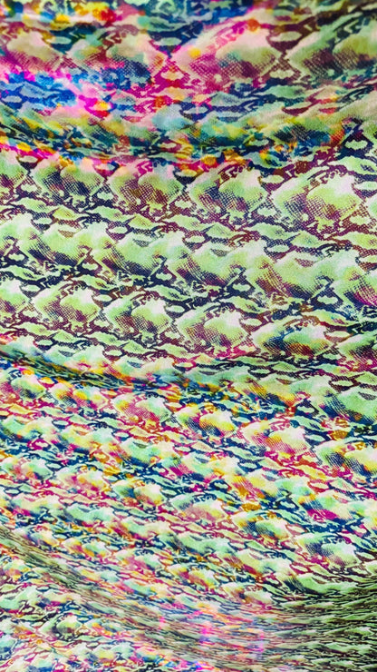 NEW Iridescent Cobra snake design with ilusión foggy foil all over print on metallic nylon spandex 4way stretch 58/60" Sold by the YD.