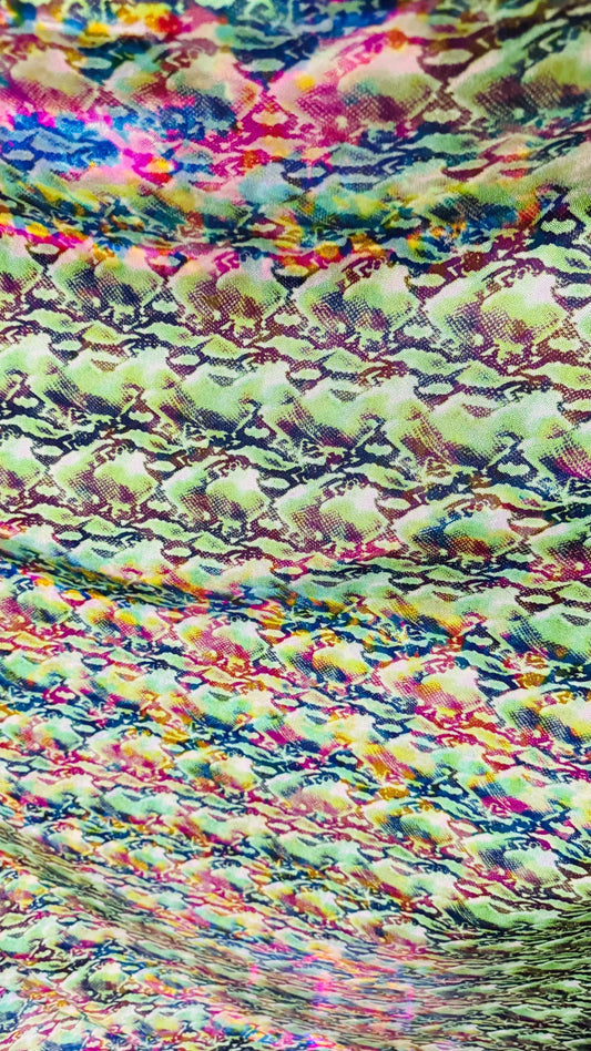 NEW Iridescent Cobra snake design with ilusión foggy foil all over print on metallic nylon spandex 4way stretch 58/60" Sold by the YD.