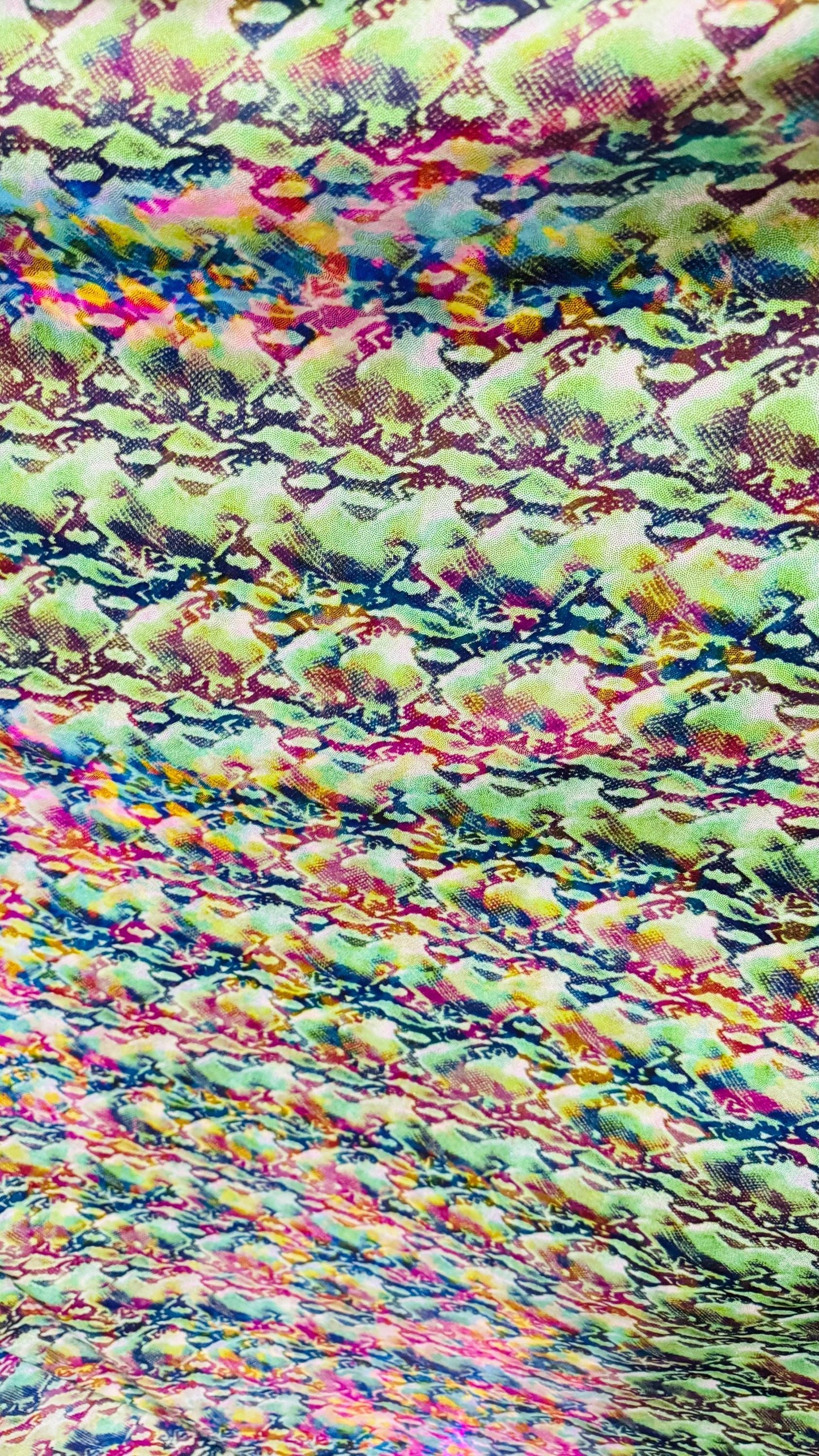NEW Iridescent Cobra snake design with ilusión foggy foil all over print on metallic nylon spandex 4way stretch 58/60" Sold by the YD.