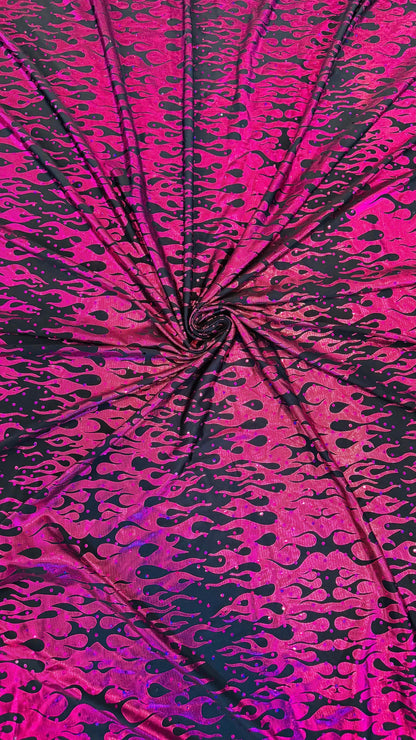 New hologram flames design metallic poly spandex black/Fuchsia 2-way stretch 58/60” Sold by the YD. Ships worldwide from Los Angeles CA USA.