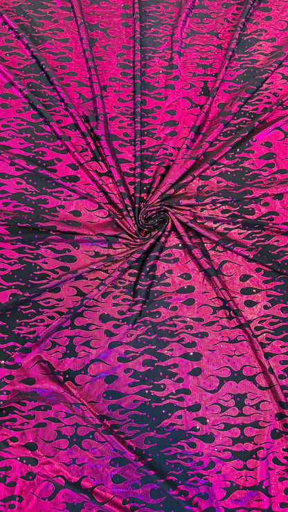 New hologram flames design metallic poly spandex black/Fuchsia 2-way stretch 58/60” Sold by the YD. Ships worldwide from Los Angeles CA USA.