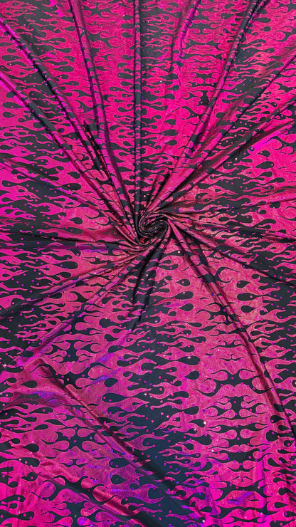 New hologram flames design metallic poly spandex black/Fuchsia 2-way stretch 58/60” Sold by the YD. Ships worldwide from Los Angeles CA USA.