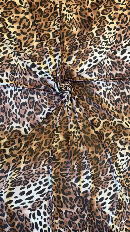 New exotic Jaguar design print on power mesh 4-way stretch 58/60” Sold by the YD. Ships worldwide from Los Angeles California USA.