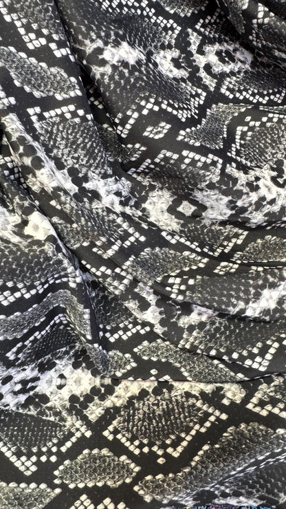 New snake print white/black  print on nylon spandex 4way stretch 58/60" Sold by the YD. Ships worldwide from Los Angeles California USA.