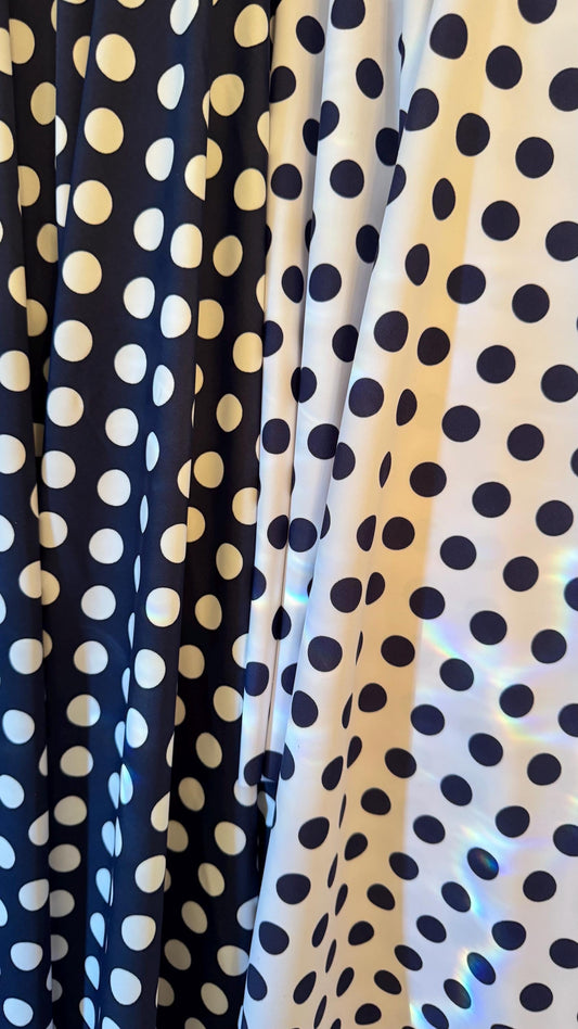Polka dots print on nylon spandex 4way stretch  58/60" sold by the Yd. Ships worldwide from Los Angeles California USA.